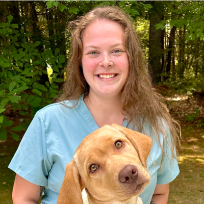 Portrait of Skylar with a dog